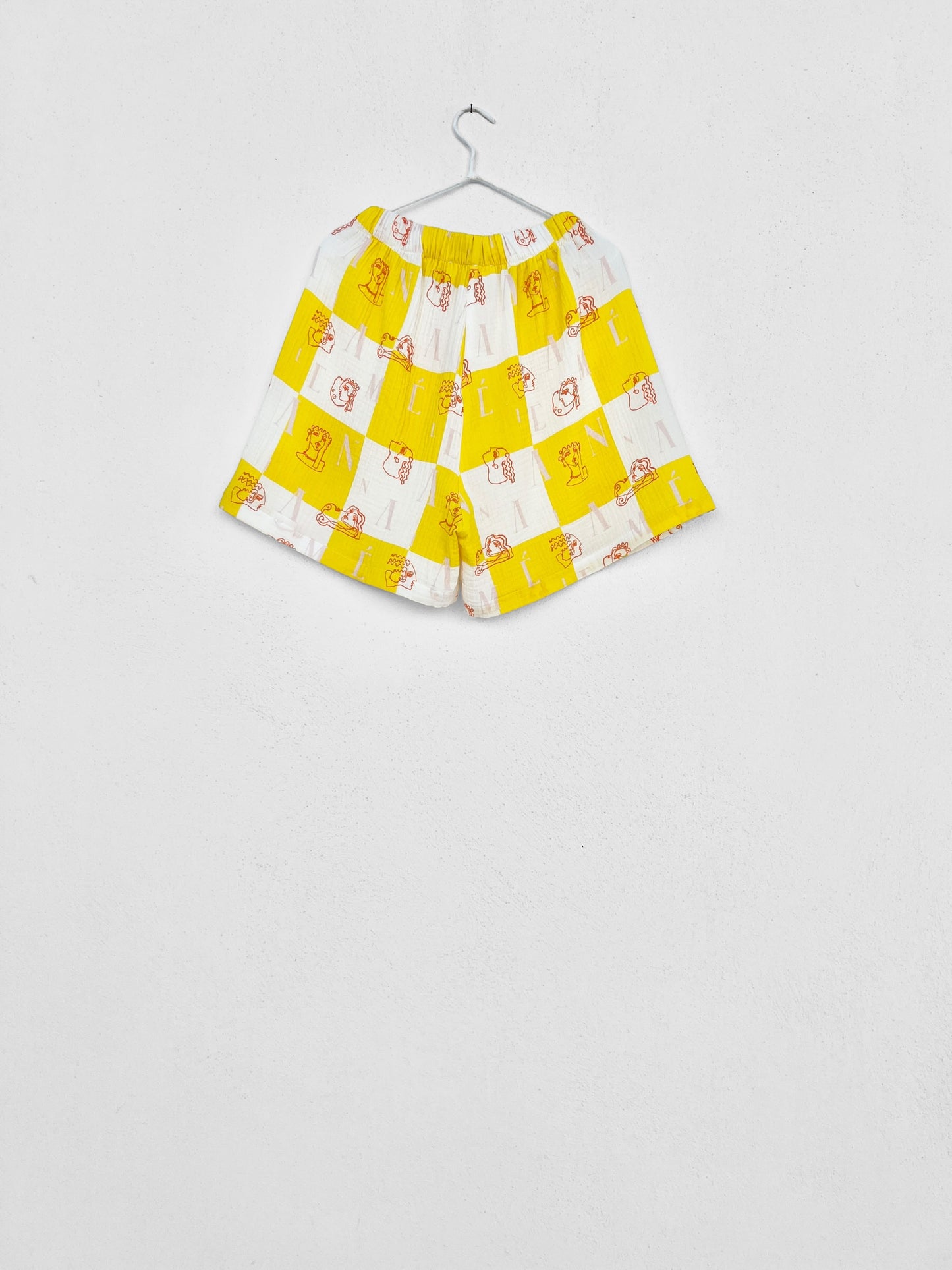 KIMOLOS GAUZE SHORTS - CHECK LOGO PRINT | YELLOW