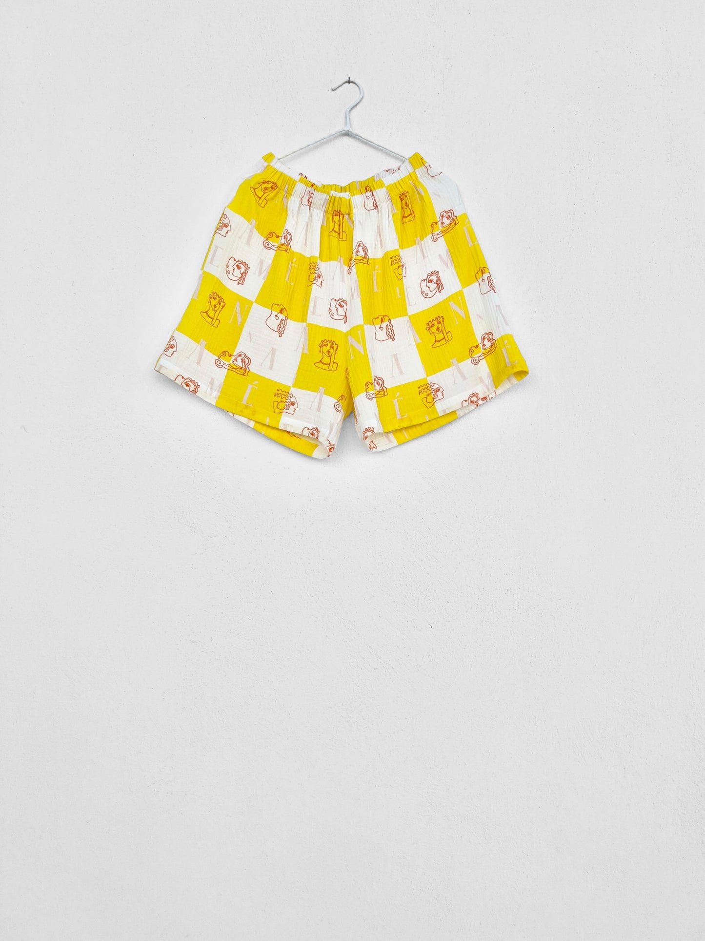 KIMOLOS GAUZE SHORTS - CHECK LOGO PRINT | YELLOW